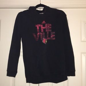 University of Louisville sweatshirt.